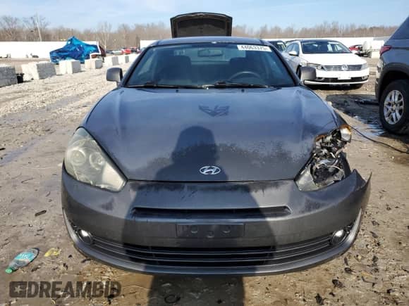2007 Hyundai Tiburon GS с VIN KMHHM66D47U256547, выставлен на аукционе Copart как лот 44063375 с пробегом 191 443 миль миль и На запчасти • Non repairable. История ставок и продаж доступна на DreamBid. Изображение 5.