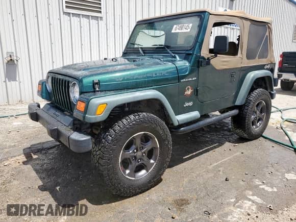 2000 Jeep Wrangler SE with VIN 1J4FA29P2YP800721, listed as a Copart auction lot 67490145 with 128,182 mi miles and Clean title. Bid and sale history available at DreamBid. Image 1.
