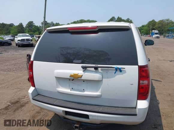 2014 Chevrolet Tahoe Commercial with VIN 1GNLC2E07ER228838, listed as a IAAI auction lot 42410417 with 140,342 mi miles and . Bid and sale history available at DreamBid. Image 16.