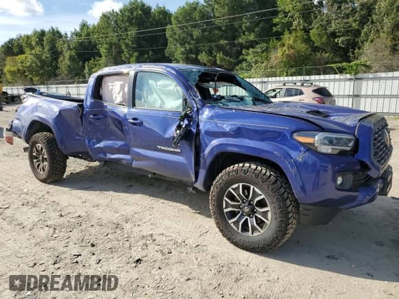 2022 Toyota Tacoma SR5 with VIN 3TYDZ5BN0NT005849, listed as a Copart auction lot 71113125 with 63,449 mi miles and Salvage title. Bid and sale history available at DreamBid. Image 4.