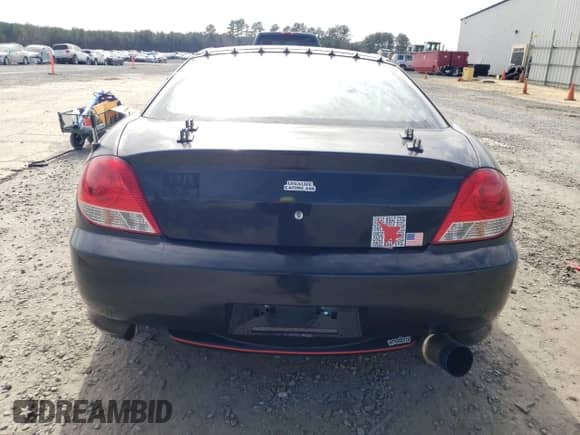 2005 Hyundai Tiburon GT с VIN KMHHN65F95U181518, выставлен на аукционе Copart как лот 41125854 с пробегом 158 863 миль миль и Списание • Salvage title. История ставок и продаж доступна на DreamBid. Изображение 10.