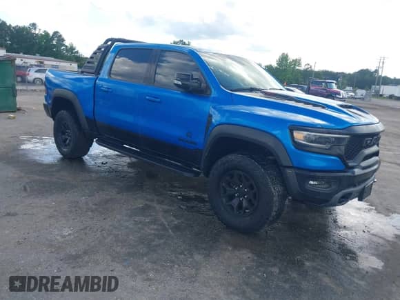 2021 Ram 1500 TRX with VIN 1C6SRFU98MN804461, listed as a IAAI auction lot 42300032 with 28,735 mi miles and . Bid and sale history available at DreamBid. Image 1.