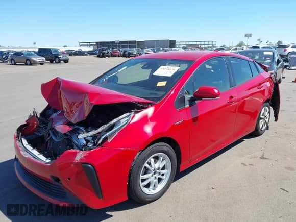 2021 Toyota Prius L Eco with VIN JTDKAMFU6M3152201, listed as a IAAI auction lot 43278670 with 144,414 mi miles and . Bid and sale history available at DreamBid. Image 2.