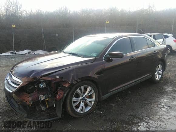 2010 Ford Taurus SEL with VIN 1FAHP2HW8AG135647, listed as a IAAI auction lot 40687874 with 101,000 mi miles and . Bid and sale history available at DreamBid. Image 2.