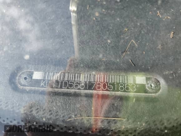 2007 Chevrolet Aveo LS z VIN KL1TD56617B051863, wystawiony jako Copart lot #79996804 z przebiegiem Nie podano mil oraz Szkoda całkowita • Salvage title. Historia ofert i sprzedaży dostępna na DreamBid. Obrazek 12.