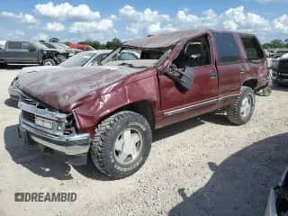1999 Chevrolet Tahoe Z71 with VIN 1GNEK13R4XJ519404, listed as a Copart auction lot 63032725 with 228,307 mi miles and Salvage title. Bid and sale history available at DreamBid. Image 1.