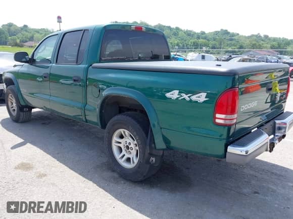2003 Dodge Dakota SLT with VIN 1D7HG48NX3S278974, listed as a IAAI auction lot 42236636 with 105,211 mi miles and . Bid and sale history available at DreamBid. Image 3.