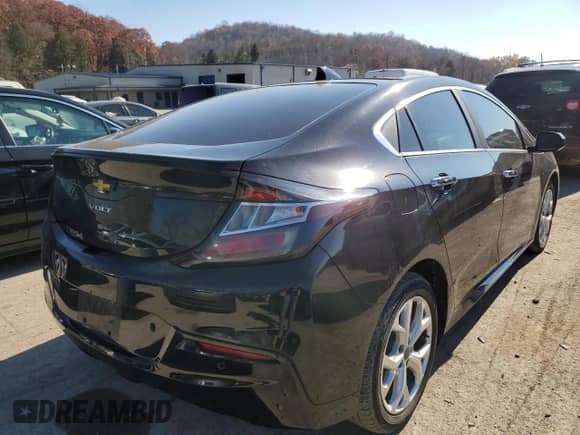 2016 Chevrolet Volt Premier z VIN 1G1RD6S56GU120906, wystawiony jako Copart lot #65921152 z przebiegiem 128 137 mil mil oraz . Historia ofert i sprzedaży dostępna na DreamBid. Obrazek 4.