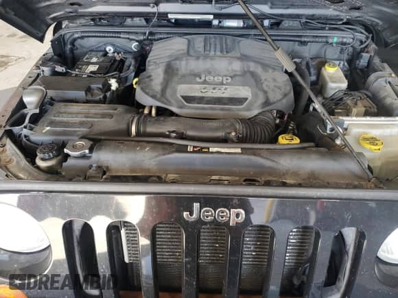 2012 Jeep Wrangler Sport with VIN 1C4AJWAG4CL215593, listed as a Copart auction lot 71013325 with 112,333 mi miles and Salvage title. Bid and sale history available at DreamBid. Image 12.