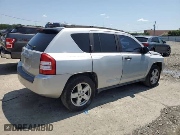 2007 Jeep Compass Sport with VIN 1J8FT47W87D158424, listed as a Copart auction lot 61333865 with 243,861 mi miles and Salvage title. Bid and sale history available at DreamBid. Image 3.