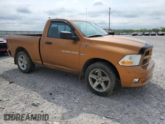 2012 Ram 1500 Express with VIN 3C6JD7AT7CG258016, listed as a Copart auction lot 53354615 with 111,134 mi miles and Salvage title. Bid and sale history available at DreamBid. Image 4.
