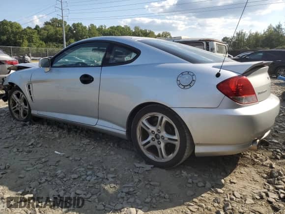 2006 Hyundai Tiburon GT с VIN KMHHN65F76U229244, выставлен на аукционе Copart как лот 71157904 с пробегом 228 575 миль миль и Списание • Salvage title. История ставок и продаж доступна на DreamBid. Изображение 2.
