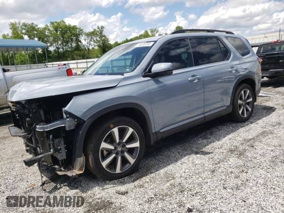 2023 Honda Pilot Touring с VIN 5FNYG2H78PB006054, выставлен на аукционе Copart как лот 56039785 с пробегом 35 831 миль миль и Списание • Salvage title. История ставок и продаж доступна на DreamBid. Изображение 1.