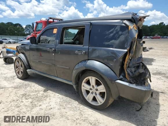2011 Dodge Nitro Heat with VIN 1D4PT4GK1BW589213, listed as a Copart auction lot 58858565 with 202,844 mi miles and Salvage title. Bid and sale history available at DreamBid. Image 2.