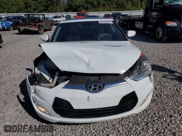 2013 Hyundai Veloster w/Gray Int z VIN KMHTC6AD4DU104557, wystawiony jako Copart lot #86129525 z przebiegiem 109 991 mil mil oraz Szkoda całkowita • Salvage title. Historia ofert i sprzedaży dostępna na DreamBid. Obrazek 5.