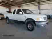 1999 Ford F-150 z VIN 1FTRX18W9XKA31862, wystawiony jako Copart lot #80758555 z przebiegiem 150 645 mil mil oraz Szkoda całkowita • Salvage title. Historia ofert i sprzedaży dostępna na DreamBid. Obrazek 4.