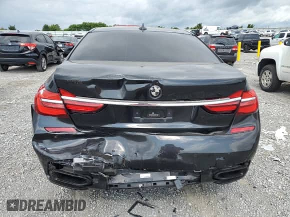 2016 BMW 7 Series 750i with VIN WBA7F0C53GGM20760, listed as a Copart auction lot 57230334 with 77,588 mi miles and Salvage title. Bid and sale history available at DreamBid. Image 6.