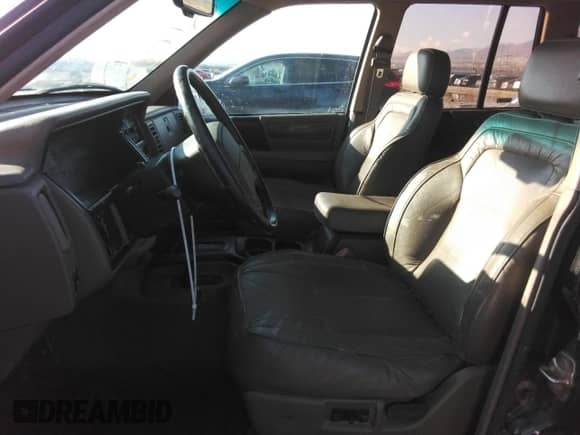 1993 Jeep Grand Cherokee Limited z VIN 1J4GZ78Y5PC544956, wystawiony jako Copart lot #84659285 z przebiegiem 153 945 mil mil oraz Szkoda całkowita • Salvage title. Historia ofert i sprzedaży dostępna na DreamBid. Obrazek 7.