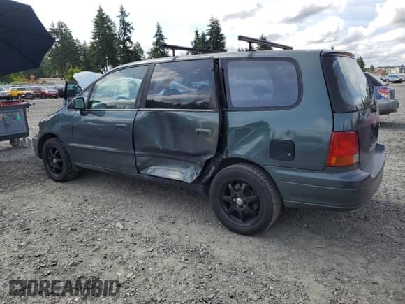 1997 Honda Odyssey with VIN JHMRA1847VC014113, listed as a Copart auction lot 59270225 with 118,136 mi miles and Salvage title. Bid and sale history available at DreamBid. Image 2.