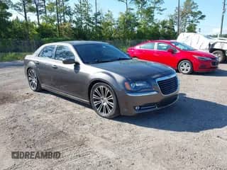 2014 Chrysler 300 S with VIN 2C3CCABG1EH148511, listed as a IAAI auction lot 42591400 with 196,626 mi miles and . Bid and sale history available at DreamBid. Image 1.
