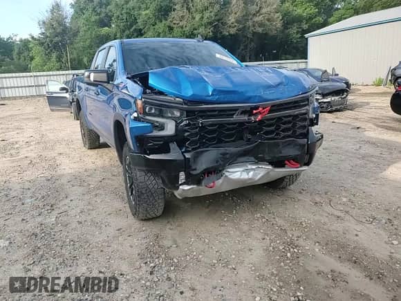 2023 Chevrolet Silverado 1500 ZR2 z VIN 3GCUDHEL0PG215228, wystawiony jako Copart lot #62137075 z przebiegiem 33 353 mil mil oraz Nie do naprawy • Non repairable. Historia ofert i sprzedaży dostępna na DreamBid. Obrazek 13.