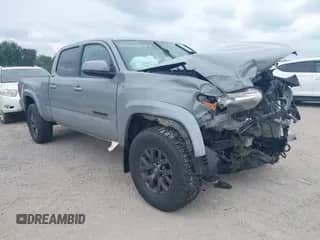 2021 Toyota Tacoma SR5 z VIN 3TMDZ5BN7MM106221, wystawiony jako IAAI lot #42827931 z przebiegiem 71 851 mil mil oraz . Historia ofert i sprzedaży dostępna na DreamBid. Obrazek 1.