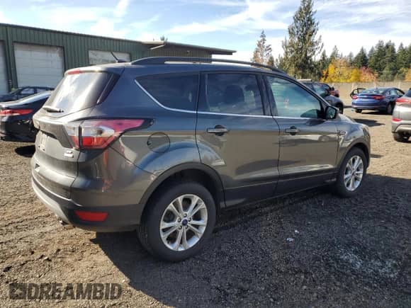2017 Ford Escape SE с VIN 1FMCU9GD9HUC88602, выставлен на аукционе Copart как лот 86845435 с пробегом 71 714 миль миль и Чистый • Clean title. История ставок и продаж доступна на DreamBid. Изображение 3.