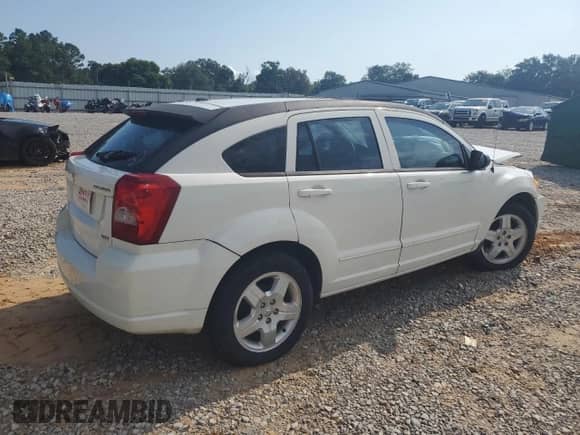 2009 Dodge Caliber SXT with VIN 1B3HB48A89D224125, listed as a Copart auction lot 61968005 with 241,959 mi miles and Salvage title. Bid and sale history available at DreamBid. Image 3.