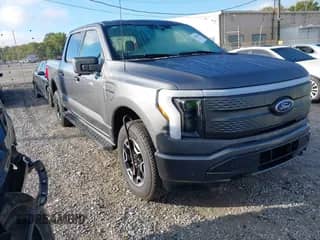 2023 Ford F-150 Lightning Pro with VIN 1FTVW1EL0PWG46949, listed as a IAAI auction lot 43246181 with 7,971 mi miles and . Bid and sale history available at DreamBid. Image 1.