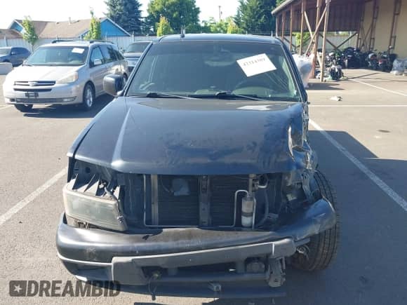 2011 Chevrolet Colorado 1LT z VIN 1GCHTCFE2B8115945, wystawiony jako IAAI lot #42314389 z przebiegiem 250 571 mil mil oraz . Historia ofert i sprzedaży dostępna na DreamBid. Obrazek 13.