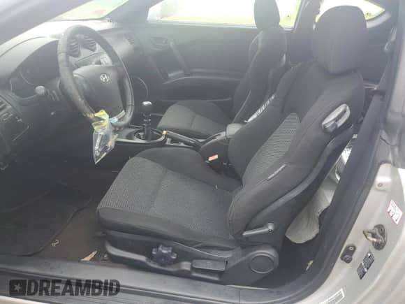 2003 Hyundai Tiburon GT с VIN KMHHN65F93U019840, выставлен на аукционе Copart как лот 74063394 с пробегом Не указан миль и На запчасти • Non repairable. История ставок и продаж доступна на DreamBid. Изображение 7.