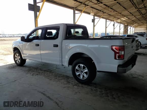 2020 Ford F-150 XL with VIN 1FTEW1C45LKD11814, listed as a Copart auction lot 69002595 with 106,500 mi miles and Salvage title. Bid and sale history available at DreamBid. Image 2.