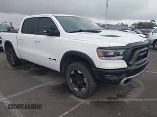 2022 Ram 1500 Rebel z VIN 1C6SRFLT4NN282636, wystawiony jako IAAI lot #43369975 z przebiegiem 38 884 mil mil oraz . Historia ofert i sprzedaży dostępna na DreamBid. Obrazek 1.