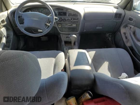 1995 Toyota Camry LE z VIN 4T1GK12E7SU092786, wystawiony jako Copart lot #81152935 z przebiegiem 184 695 mil mil oraz Czysty tytuł • Clean title. Historia ofert i sprzedaży dostępna na DreamBid. Obrazek 8.