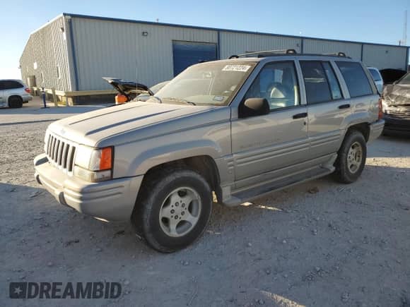 1998 Jeep Grand Cherokee with VIN 1J4FX48S4WC345469, listed as a Copart auction lot 80721224 with 201,543 mi miles and Salvage title. Bid and sale history available at DreamBid. Image 1.