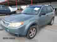 2011 Subaru Forester X with VIN JF2SHBBC8BH724058, listed as a IAAI auction lot 43547335 with 183,923 mi miles and . Bid and sale history available at DreamBid. Image 2.