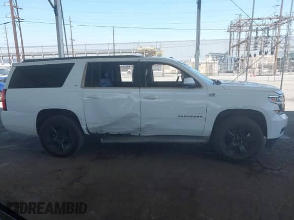 2015 Chevrolet Suburban LT z VIN 1GNSCJKC1FR137893, wystawiony jako IAAI lot #42602438 z przebiegiem 157 441 mil mil oraz . Historia ofert i sprzedaży dostępna na DreamBid. Obrazek 13.