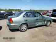 2004 Hyundai Accent GL z VIN KMHCG45C24U503929, wystawiony jako Copart lot #71820915 z przebiegiem 146 643 mil mil oraz Szkoda całkowita • Salvage title. Historia ofert i sprzedaży dostępna na DreamBid. Obrazek 3.