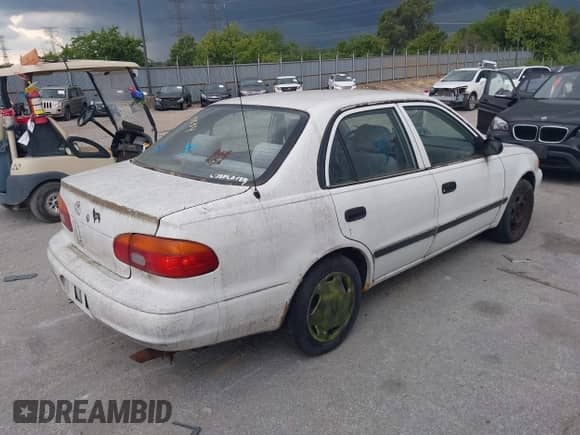1999 Chevrolet Prizm with VIN 1Y1SK5283XZ418878, listed as a IAAI auction lot 42830534 with 121,676 mi miles and . Bid and sale history available at DreamBid. Image 4.