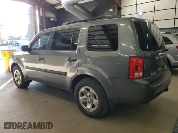 2009 Honda Pilot LX with VIN 5FNYF38219B009703, listed as a Copart auction lot 86054625 with 215,143 mi miles and Clean title. Bid and sale history available at DreamBid. Image 2.