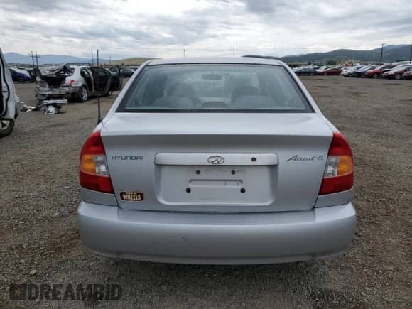 2000 Hyundai Accent with VIN KMHCG45G8YU120795, listed as a Copart auction lot 61005175 with 96,515 mi miles and Clean title. Bid and sale history available at DreamBid. Image 6.