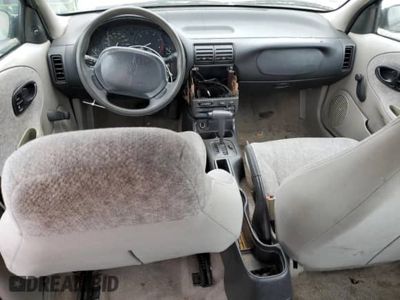 1996 Saturn SL z VIN 1G8ZH5288TZ202529, wystawiony jako Copart lot #47859865 z przebiegiem 135 406 mil mil oraz Szkoda całkowita • Salvage title. Historia ofert i sprzedaży dostępna na DreamBid. Obrazek 8.