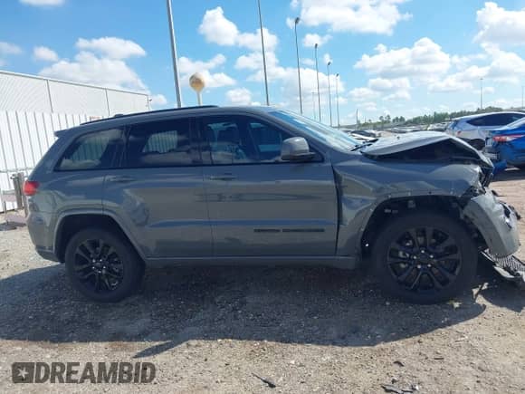 2019 Jeep Grand Cherokee Altitude z VIN 1C4RJEAGXKC832489, wystawiony jako IAAI lot #43379107 z przebiegiem 56 584 mil mil oraz . Historia ofert i sprzedaży dostępna na DreamBid. Obrazek 13.
