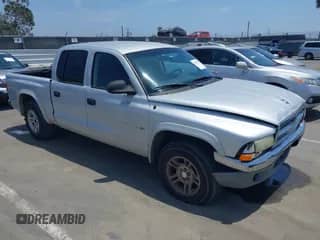 2002 Dodge Dakota SLT with VIN 1B7HL48N92S714721, listed as a IAAI auction lot 42495510 with 195,609 mi miles and . Bid and sale history available at DreamBid. Image 1.