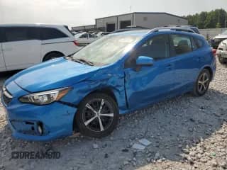 2021 Subaru Impreza Premium with VIN 4S3GTAD60M3702088, listed as a Copart auction lot 63990895 with 67,757 mi miles and Salvage title. Bid and sale history available at DreamBid. Image 1.