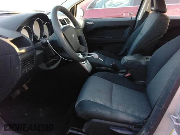 2009 Dodge Caliber SXT z VIN 1B3HB48AX9D181259, wystawiony jako Copart lot #80146215 z przebiegiem 94 695 mil mil oraz Szkoda całkowita • Salvage title. Historia ofert i sprzedaży dostępna na DreamBid. Obrazek 7.