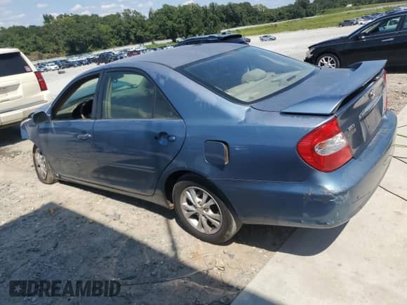 2004 Toyota Camry LE z VIN 4T1BF32KX4U570301, wystawiony jako Copart lot #71390505 z przebiegiem 264 810 mil mil oraz Szkoda całkowita • Salvage title. Historia ofert i sprzedaży dostępna na DreamBid. Obrazek 2.