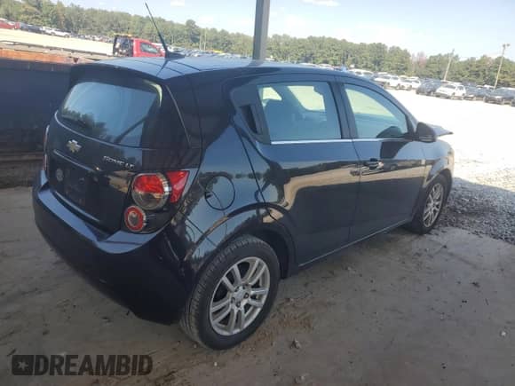 2014 Chevrolet Sonic LT with VIN 1G1JC6SH7E4136197, listed as a Copart auction lot 80256765 with 100,302 mi miles and Salvage title. Bid and sale history available at DreamBid. Image 3.
