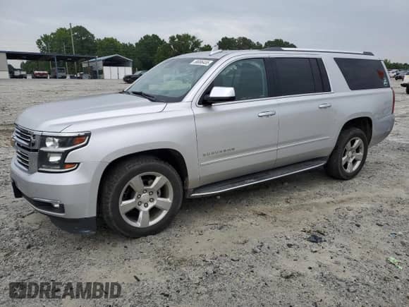 2017 Chevrolet Suburban Premier with VIN 1GNSCJKC1HR212823, listed as a Copart auction lot 58086455 with 164,130 mi miles and Salvage title. Bid and sale history available at DreamBid. Image 1.
