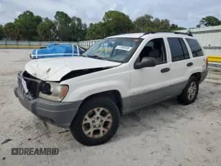 2002 Jeep Grand Cherokee Laredo with VIN 1J4GX48SX2C313897, listed as a Copart auction lot 71789765 with 149,576 mi miles and Salvage title. Bid and sale history available at DreamBid. Image 1.